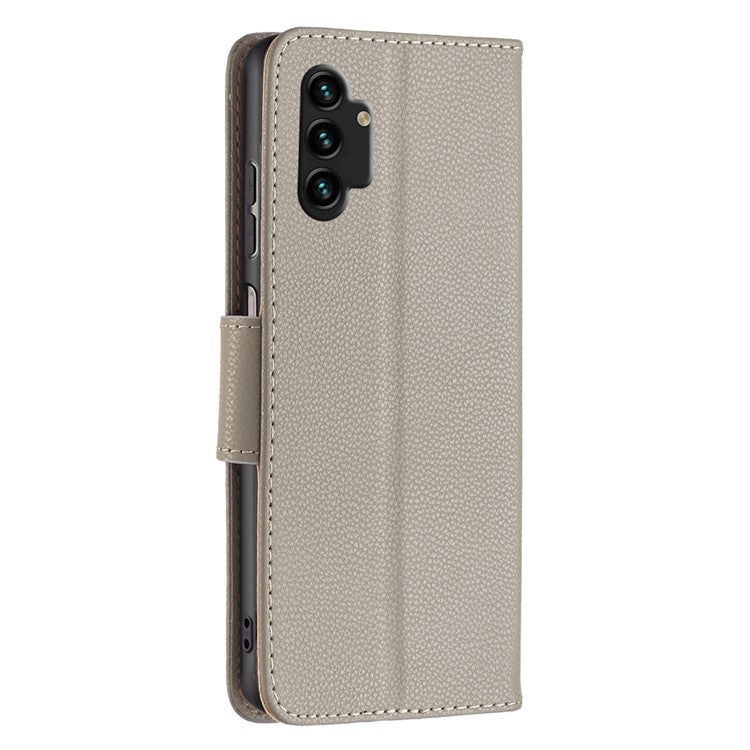 For Samsung Galaxy A13 4G / A13 5G / A04 4G (164.4 x 76.3 x 9.1 mm) Magnetic Closure Litchi Texture PU Leather Wallet Solid Color Cell Phone Cover with Strap - Grey