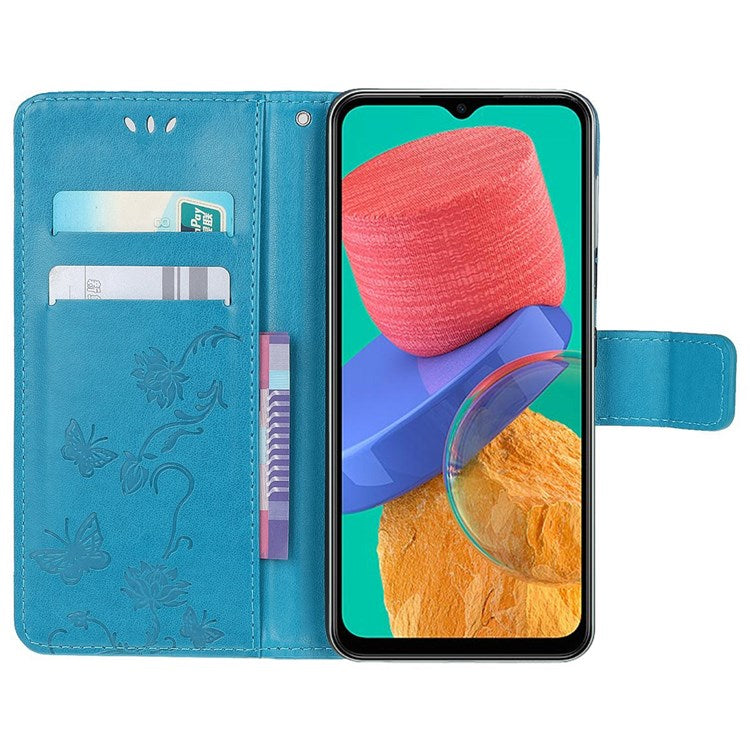 For Samsung Galaxy M33 5G (India Version) PU Leather Magnetic Flip Cover Butterfly Flower Imprinted Stand Hand Strap Wallet Purse Case - Blue
