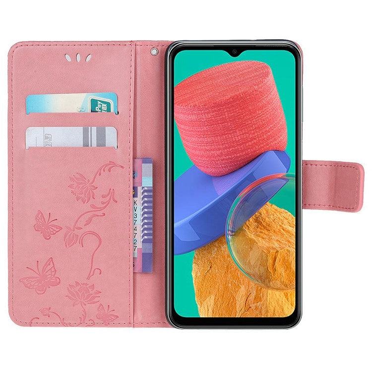 For Samsung Galaxy M33 5G (India Version) PU Leather Magnetic Flip Cover Butterfly Flower Imprinted Stand Hand Strap Wallet Purse Case - Pink