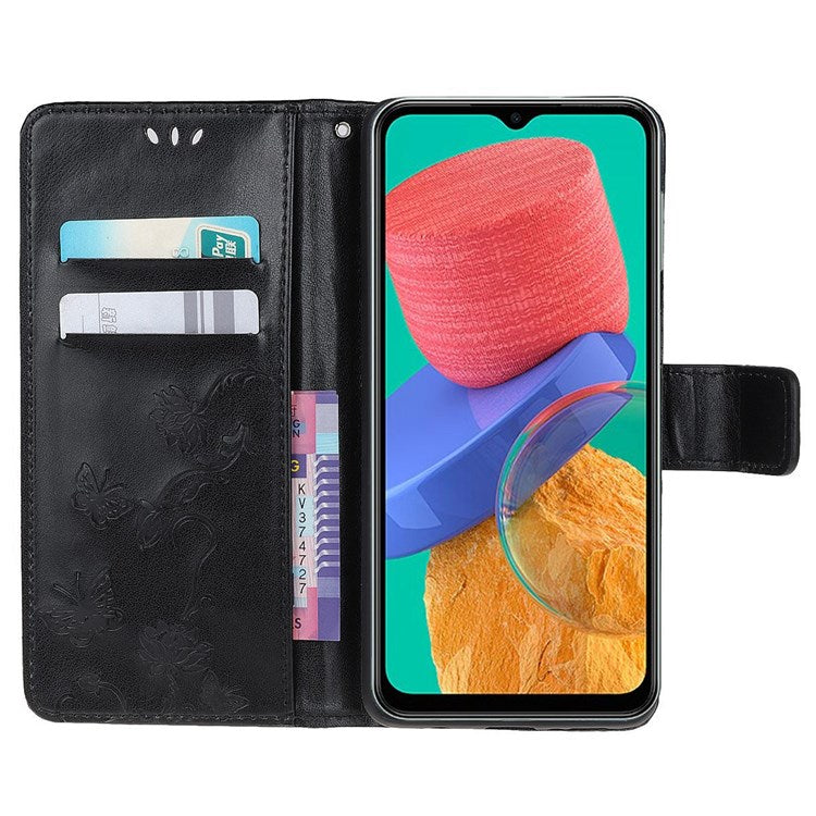 For Samsung Galaxy M33 5G (India Version) PU Leather Magnetic Flip Cover Butterfly Flower Imprinted Stand Hand Strap Wallet Purse Case - Black