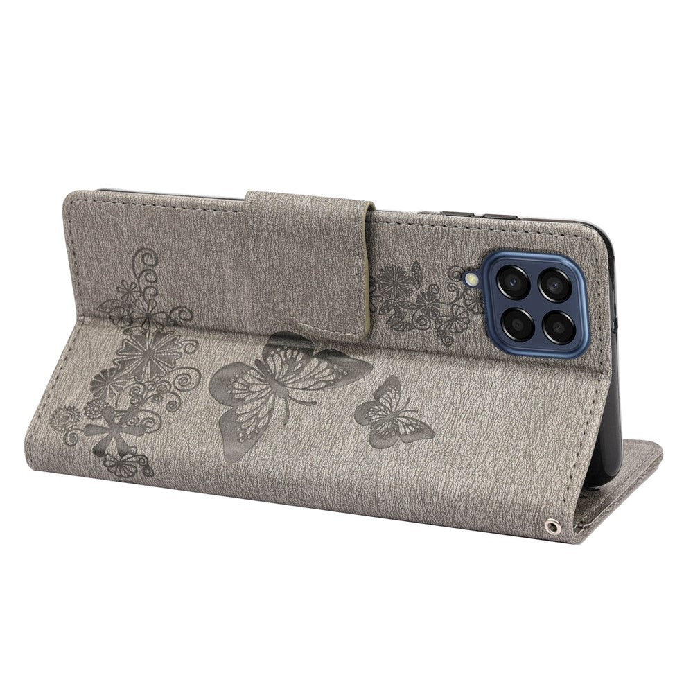 For Samsung Galaxy M33 5G (Global Version) Wallet Case Butterfly Flower Imprinted PU Leather Stand Flip Cover with Hand Strap - Grey