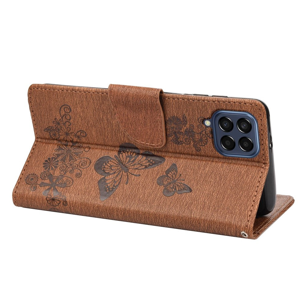 For Samsung Galaxy M33 5G (Global Version) Wallet Case Butterfly Flower Imprinted PU Leather Stand Flip Cover with Hand Strap - Brown