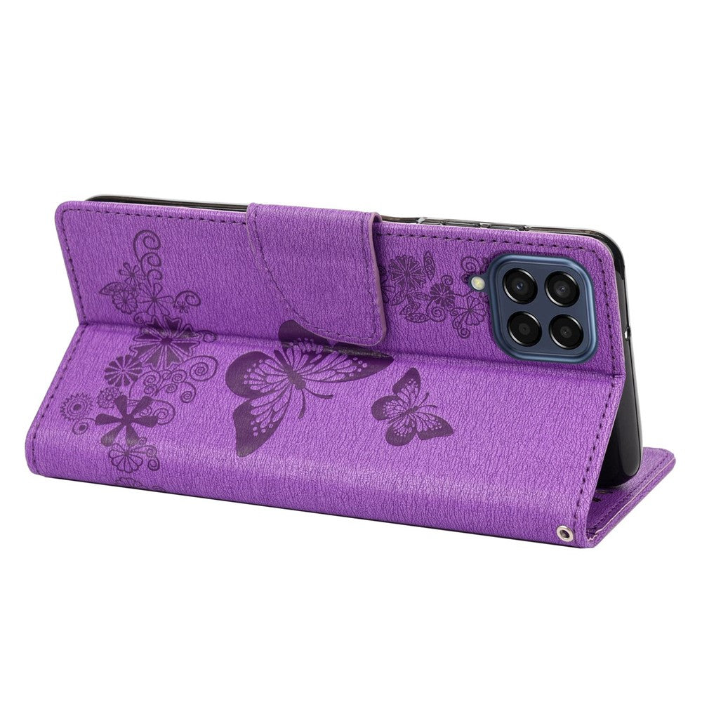 For Samsung Galaxy M33 5G (Global Version) Wallet Case Butterfly Flower Imprinted PU Leather Stand Flip Cover with Hand Strap - Purple
