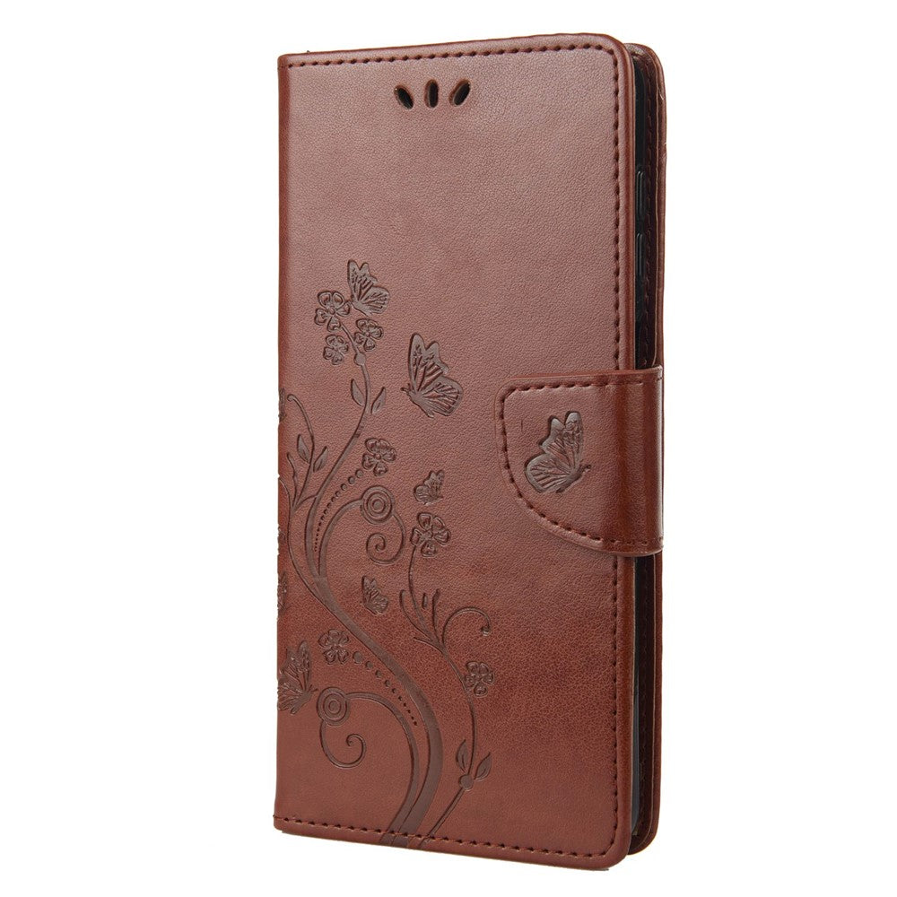 For Samsung Galaxy M33 5G (Global Version) Butterfly Flower Imprinted Wallet Case, PU Leather Foldable Stand Flip Cover with Hand Strap - Brown