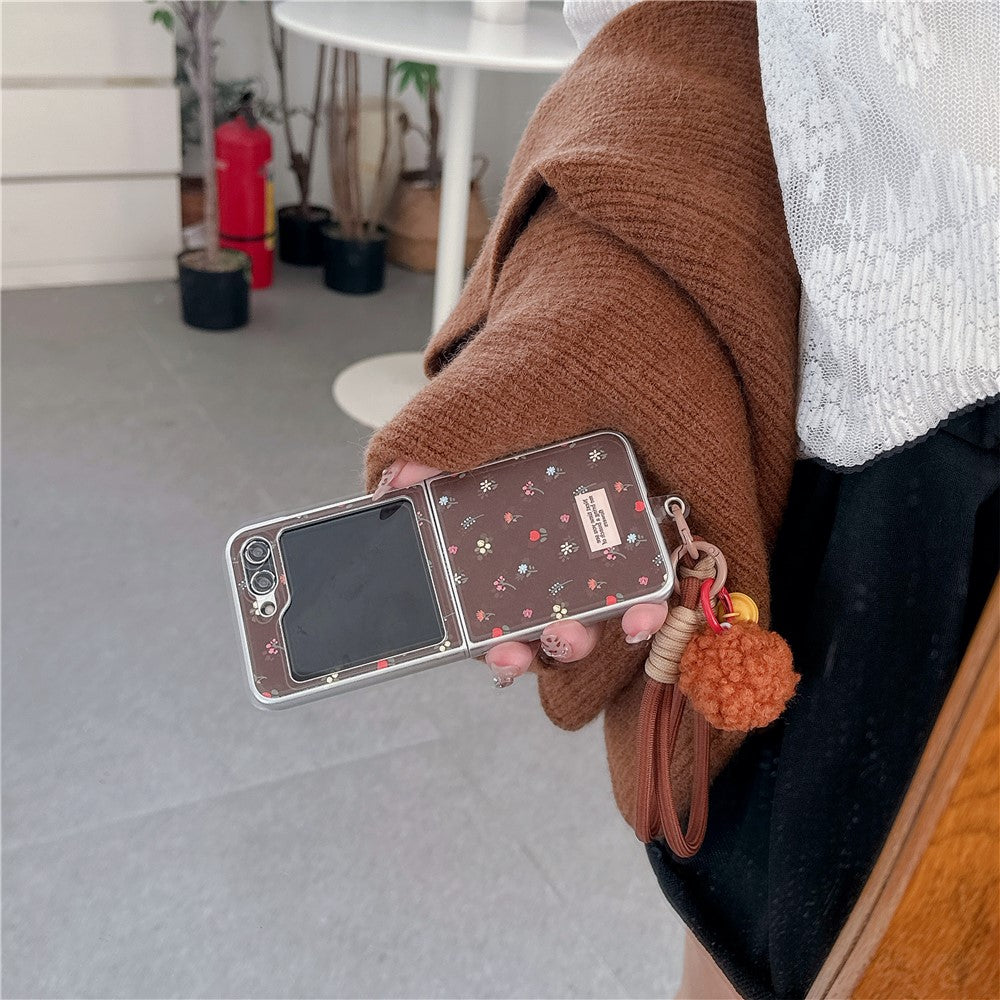 For Samsung Galaxy Z Flip7 FE 5G / Z Flip6 5G Case Leather+PC Floral Phone Cover with Hand Strap - Brown