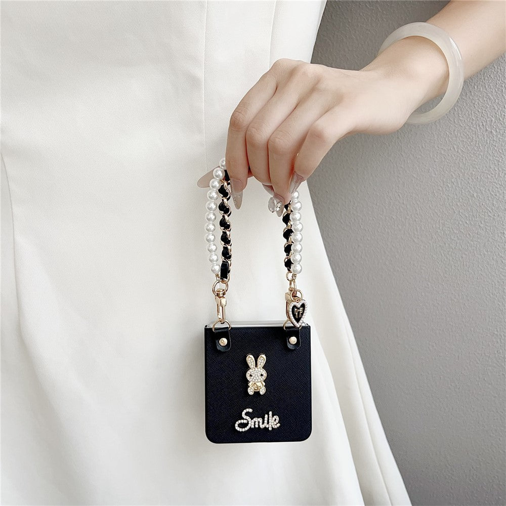 For Samsung Galaxy Z Flip7 5G Case Smile Rabbit PU + PC Phone Cover with Wrist Strap - Cross Texture