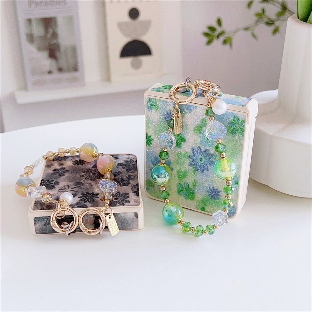 For Samsung Galaxy Z Flip7 5G Case Glitter Flower TPU + PC Phone Cover with Beaded Wrist Strap - Black