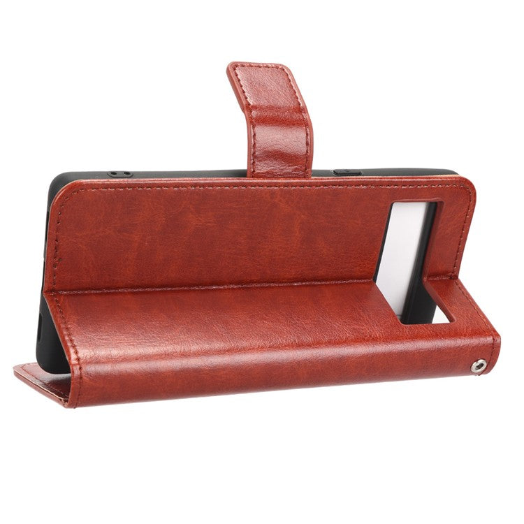 For Google Pixel 7a PU Leather Flip Phone Cover Crazy Horse Texture Wallet Phone Stand Case with Strap - Brown