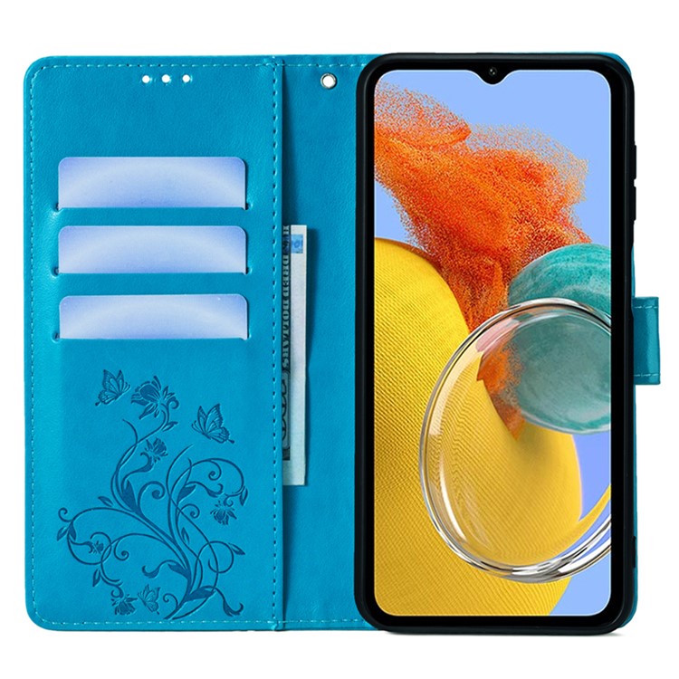 For Samsung Galaxy M14 5G Phone Case Butterfly Flower Imprinted Leather Flip Cover with Wrist Strap - Blue