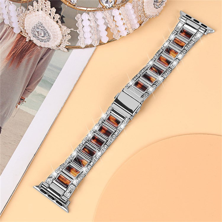 For Apple Watch Series 10 46mm / Ultra 2 Ultra 49mm / 9 8 7 45mm / SE (2023) SE (2022) SE 6 5 4 44mm / 3 2 1 42mm Stainless Steel Resin Watch Band Rhinestone Decor Wristband - Silver / Black