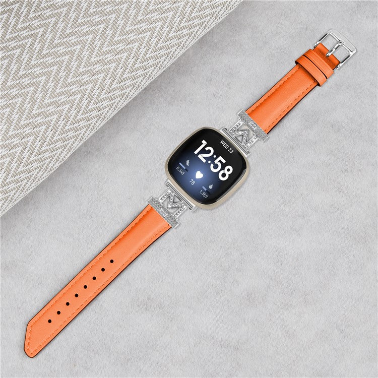 For Fitbit Versa 3 / Versa 4 / Sense / Sense 2 M Shape Rhinestone Decor Genuine Cowhide Leather Watch Strap with Silver Buckle - Orange