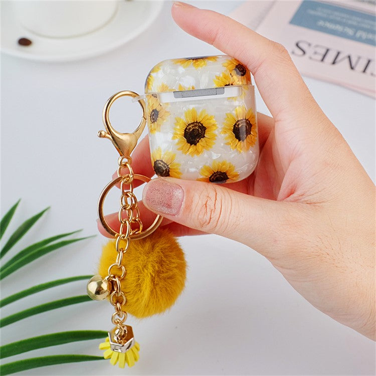For Apple AirPods with Charging Case (2016) / (2019) / AirPods with Wireless Charging Case (2019) Shockproof TPU Cover Shell Texture Sunflower Pattern Headset Case with Hair-Ball Pendant