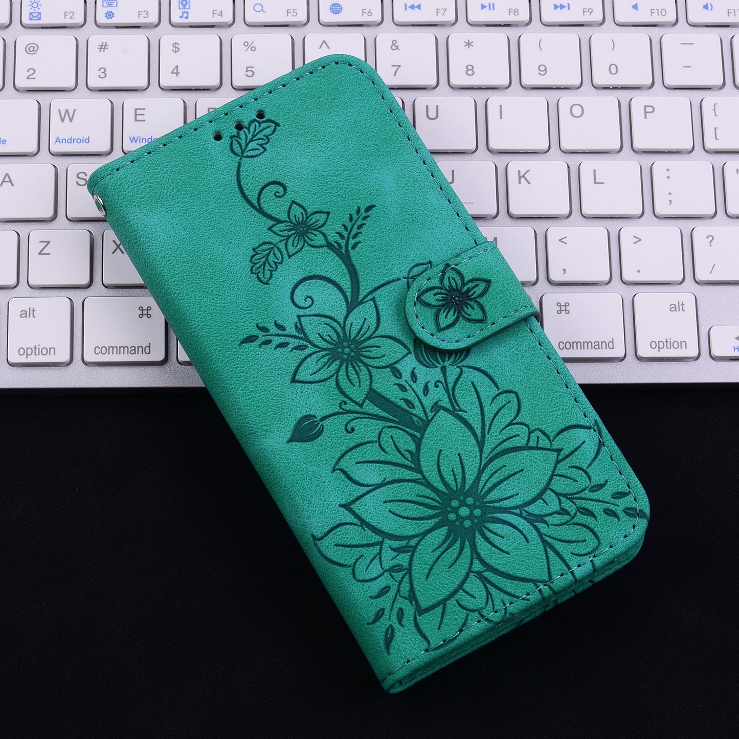 For iPhone 16e Lily Embossed Leather Phone Case(Green)