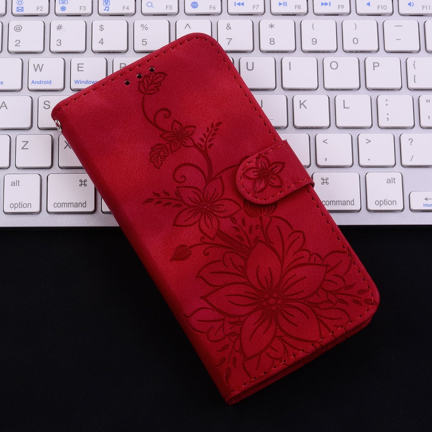 For iPhone 16e Lily Embossed Leather Phone Case(Red)