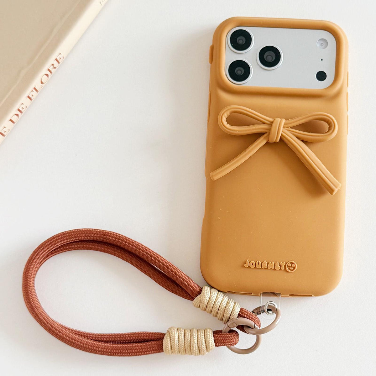 Compatible with iPhone 18 Pro Max & 17 Pro Max Bow TPU Dual-Layer PC Bulge Phone Case with Lanyard - Brown