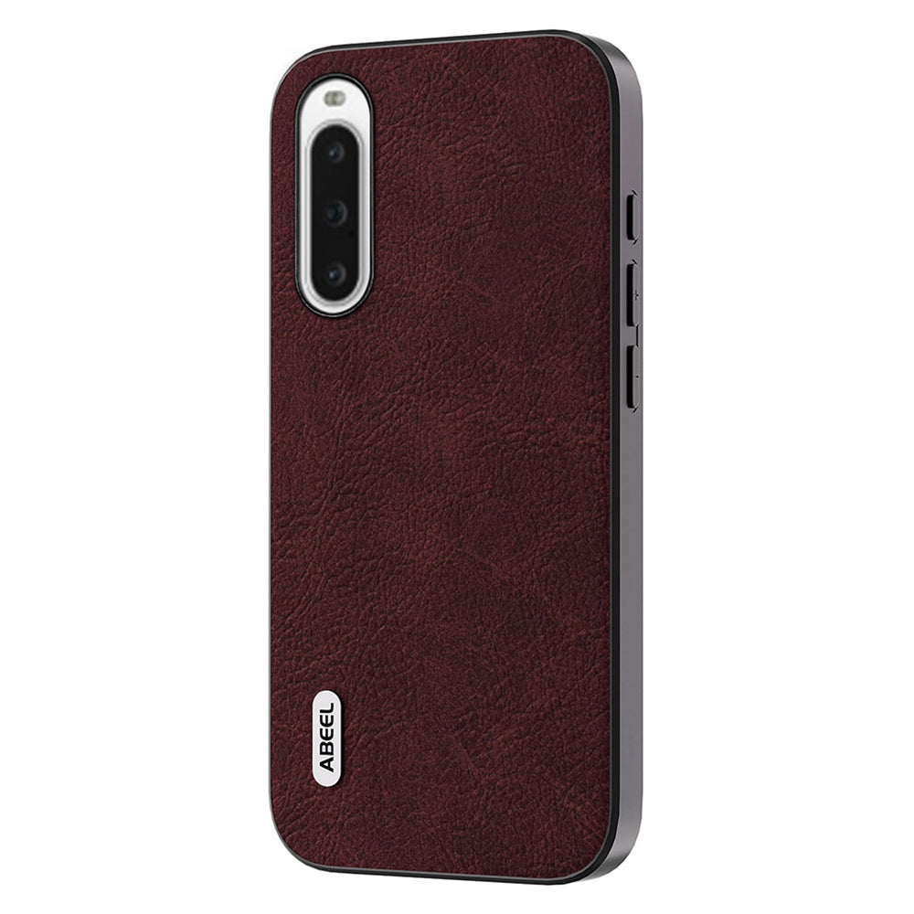 Uniqkart For Sony Xperia 10 IV 5G Protective Case PU Leather Coated PC+TPU Litchi Texture Phone Cover - Purplish Red