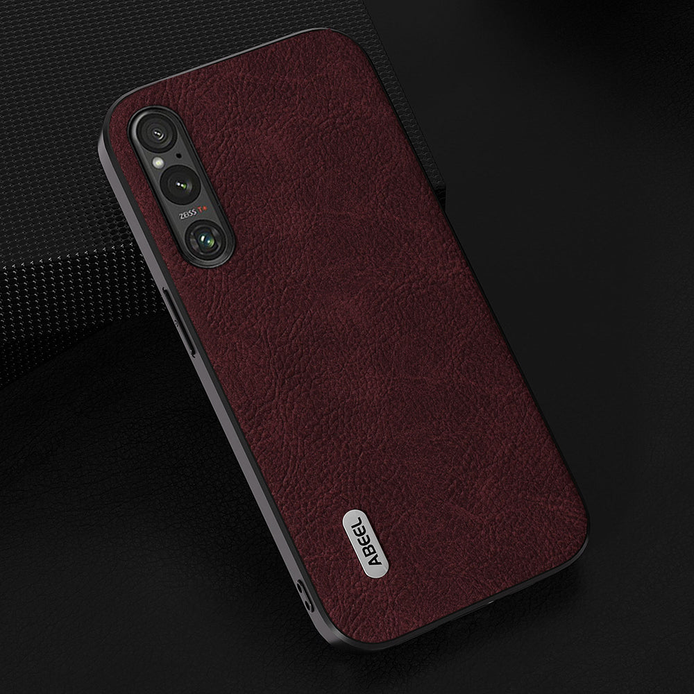 Uniqkart Slim Phone Case for Sony Xperia 1 V Shockproof Cover Litchi Texture PU Leather+PC+TPU Phone Shell - Purplish Red