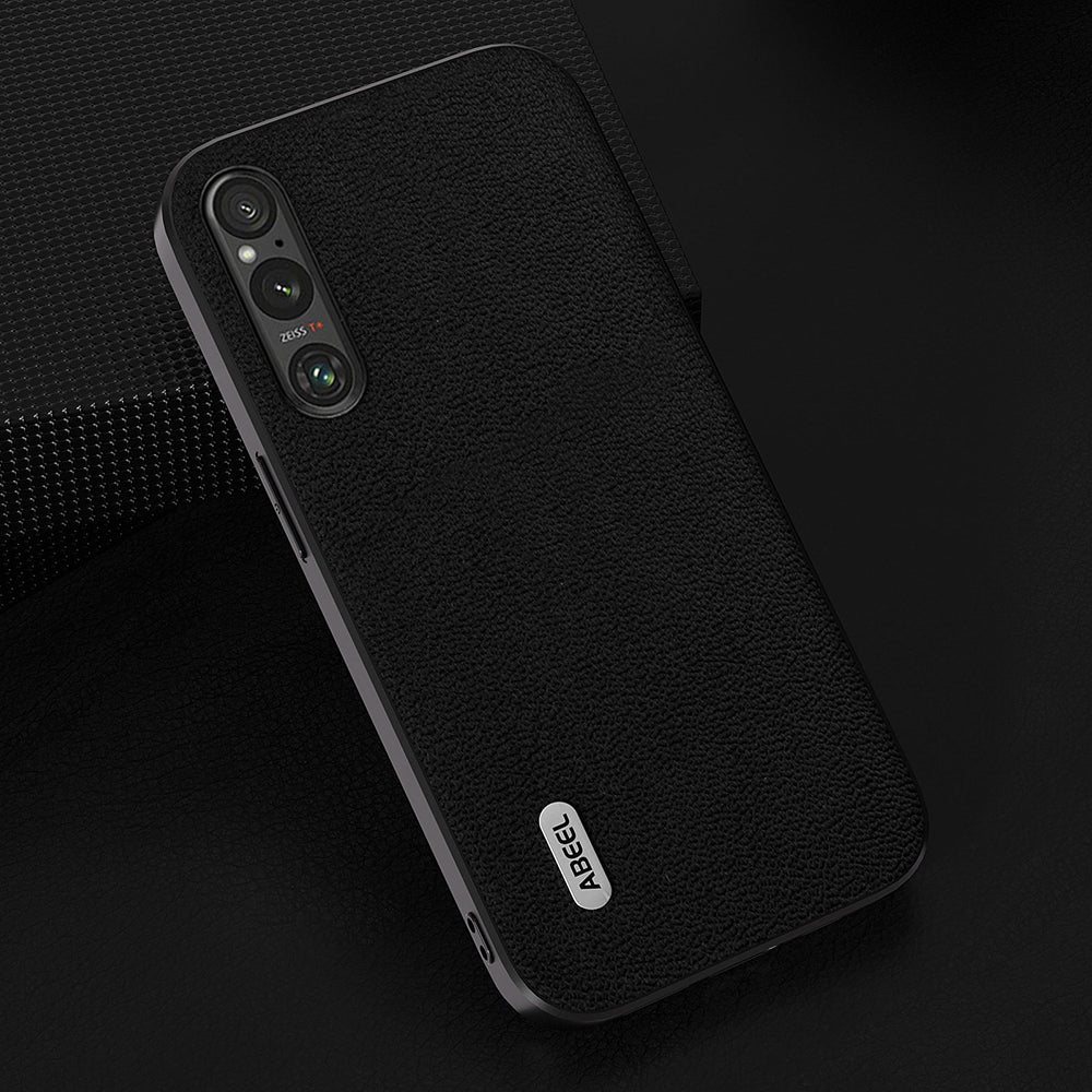 Uniqkart For Sony Xperia 1 V PC+TPU Genuine Cow Leather Coated Cover Litchi Texture Phone Case - Black