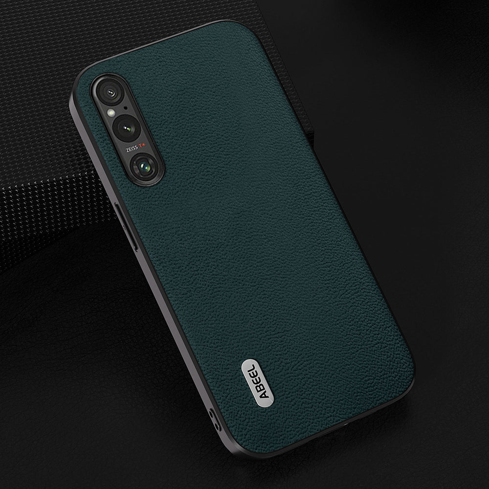 Uniqkart For Sony Xperia 1 V PC+TPU Genuine Cow Leather Coated Cover Litchi Texture Phone Case - Midnight Green