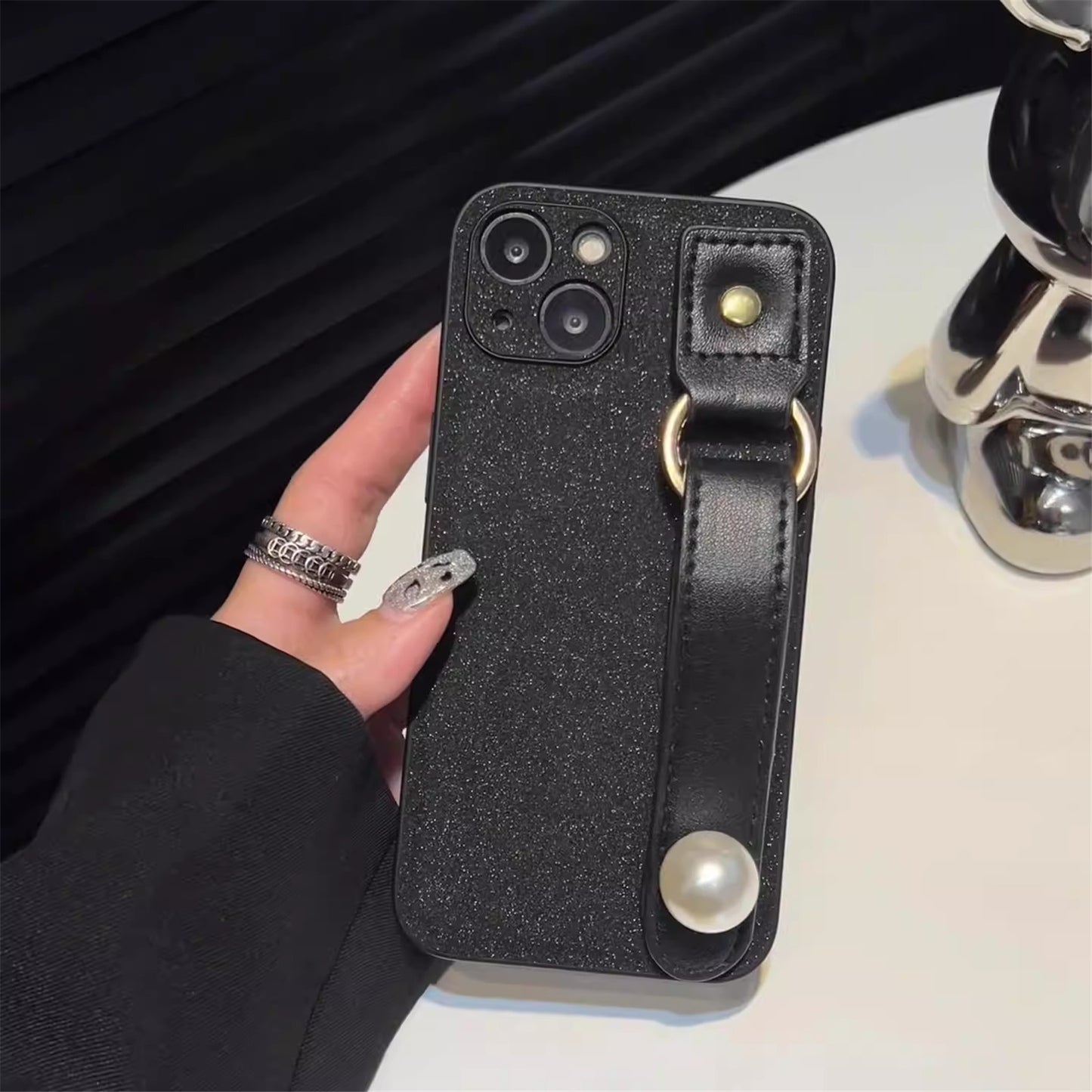 Uniqkart for iPhone 13 PU Leather+TPU Phone Case Pearl Decor Wristband Drop Protection Black Phone Back Shell