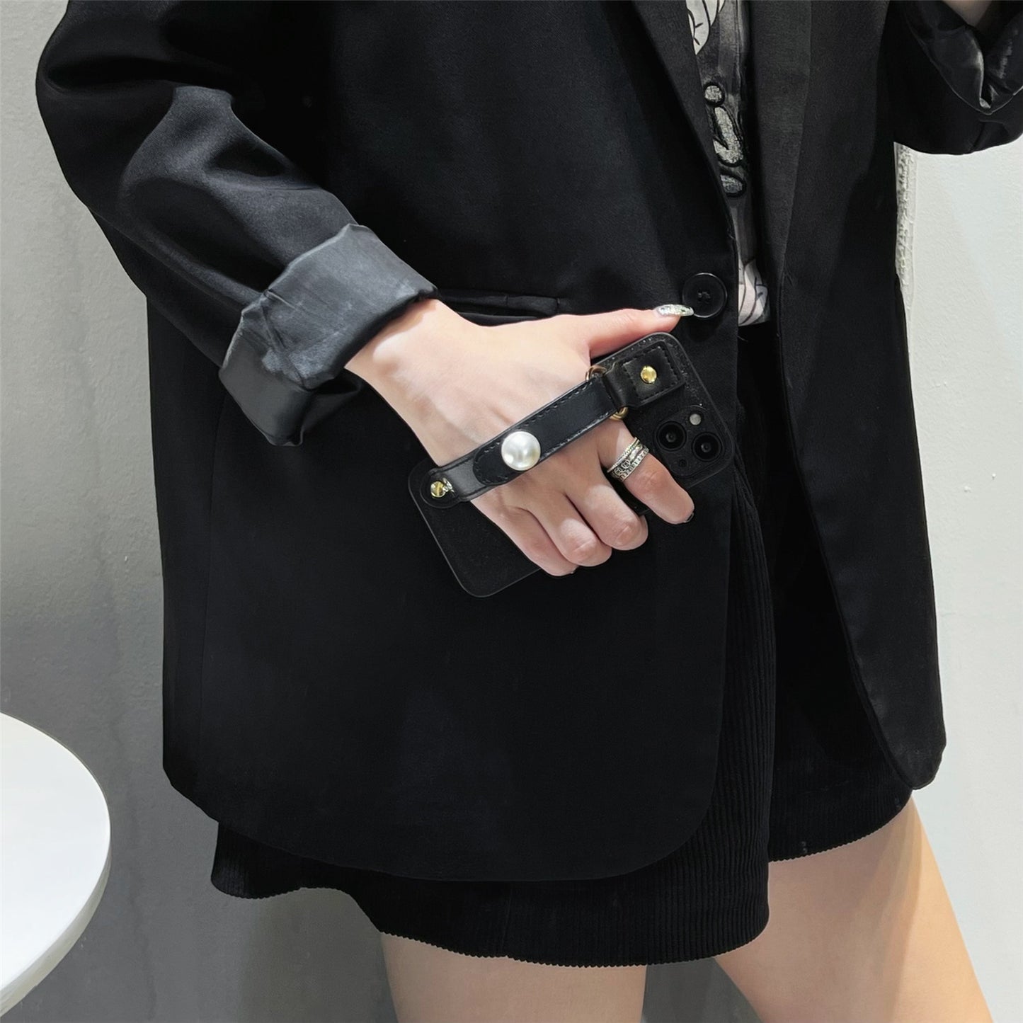 Uniqkart for iPhone 13 PU Leather+TPU Phone Case Pearl Decor Wristband Drop Protection Black Phone Back Shell