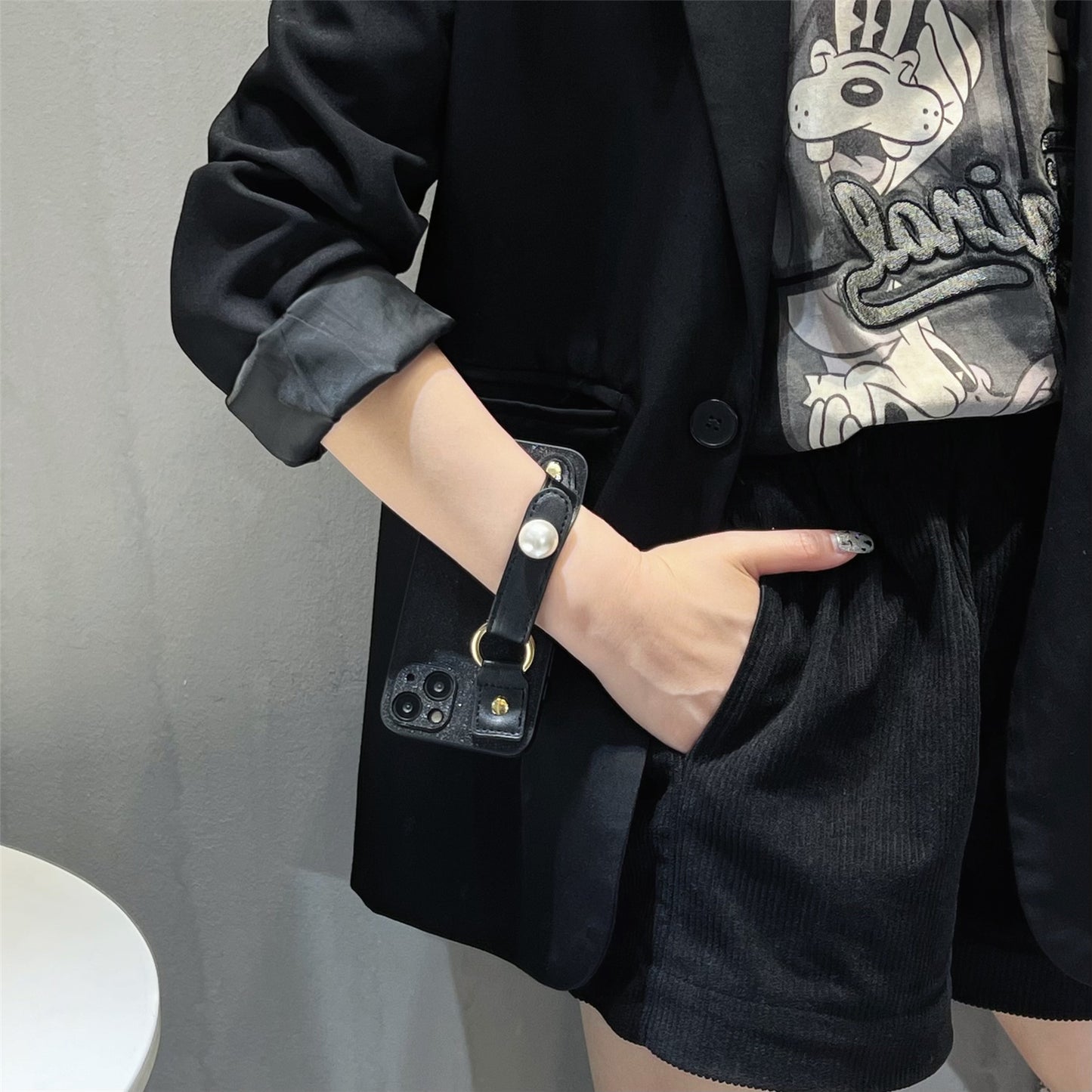 Uniqkart for iPhone 13 PU Leather+TPU Phone Case Pearl Decor Wristband Drop Protection Black Phone Back Shell