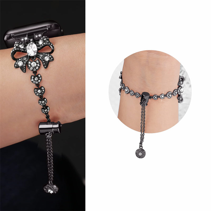 for Apple Watch Series 8 / 7 41mm / 6 / 5 / 4 / SE / SE (2022) 40mm / 3 / 2 / 1 38mm Rhinestones Decor Bowknot Bracelet Metal Watch Strap Adjustable Wrist Band - Black