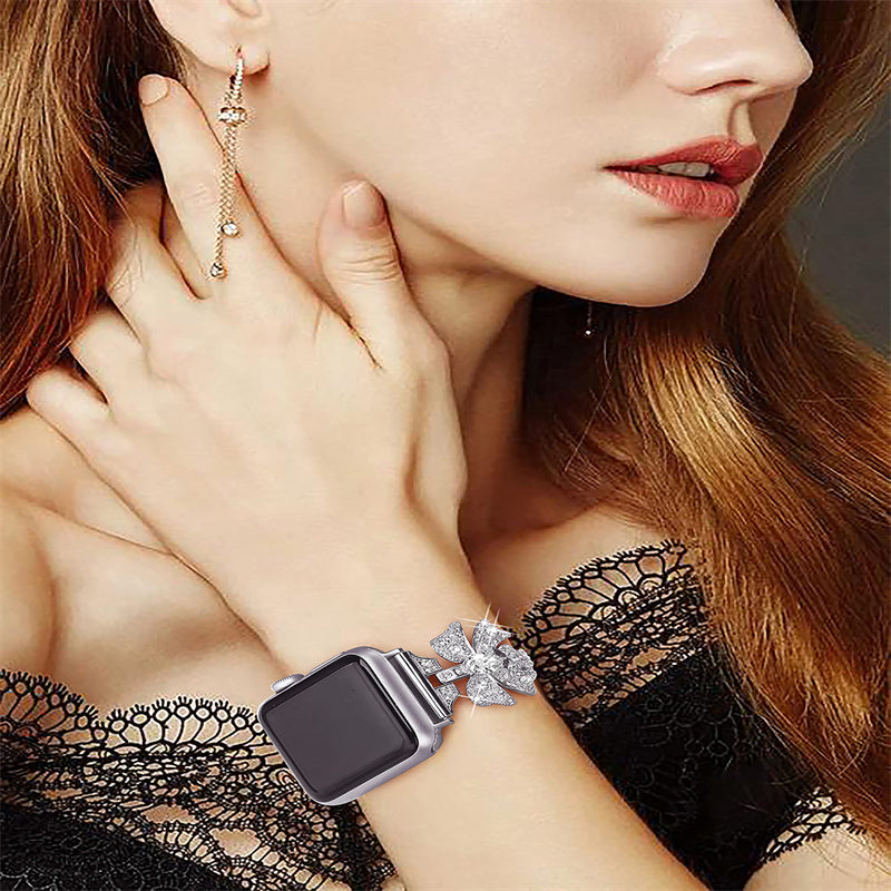 for Apple Watch Series 8 / 7 41mm / 6 / 5 / 4 / SE / SE (2022) 40mm / 3 / 2 / 1 38mm Rhinestones Decor Bowknot Bracelet Metal Watch Strap Adjustable Wrist Band - Silver
