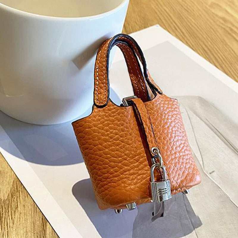 for Apple AirPods 3 / Pro / Pro 2 / AirPods with Charging Case (2016) / (2019) / AirPods with Wireless Charging Case (2019) Shockproof Cover Cowhide Leather Protective Case with Strap - Orange