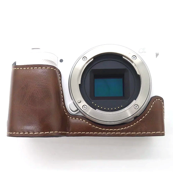 Uniqkart for Sony ZV-E10 Camera PU Leather Bottom Case Battery Opening Design Half Body Protective Cover with Hand Strap - Coffee