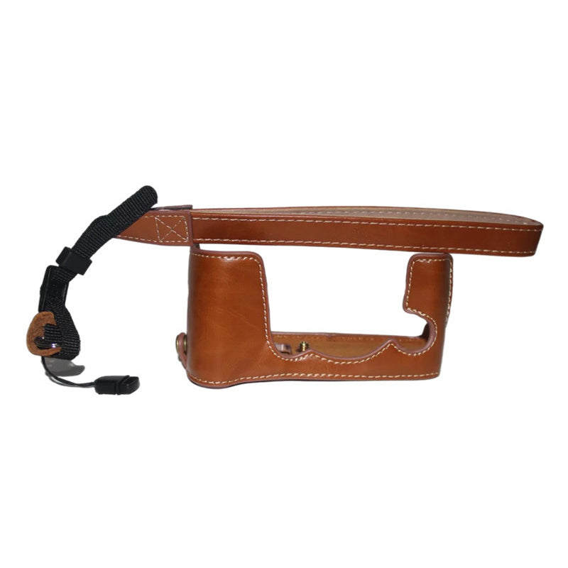 Uniqkart for Fujifilm X-E3 Camera PU Leather Bottom Case Battery Opening Design Half Body Protective Cover with Hand Strap - Brown