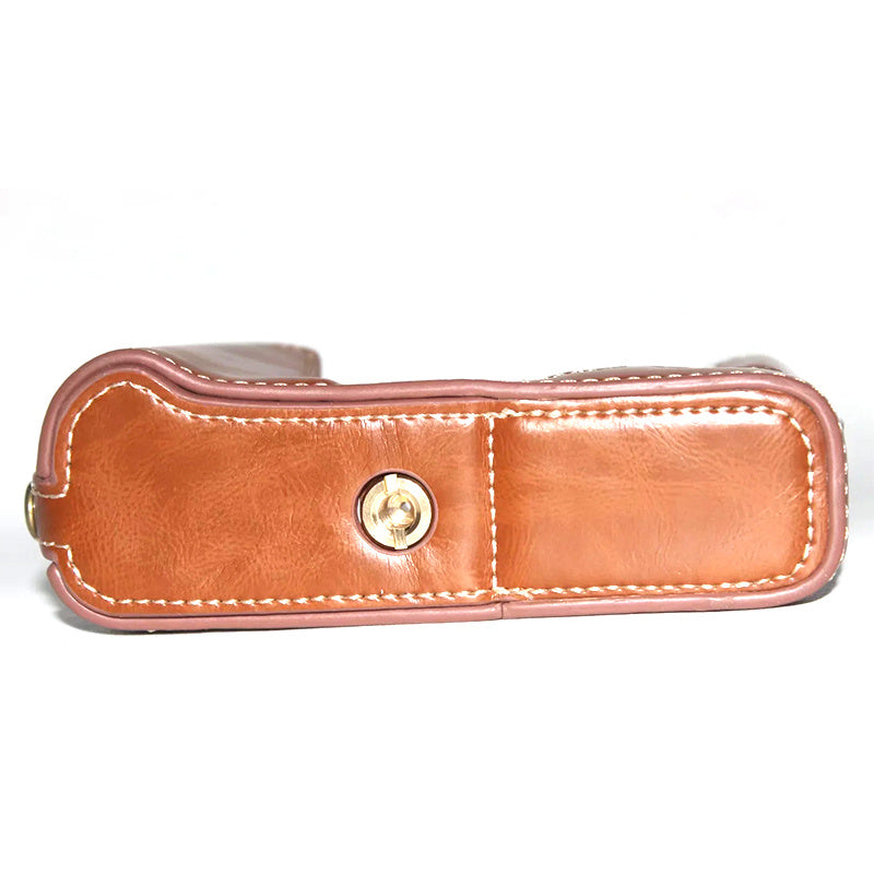 Uniqkart for Fujifilm X-E3 Camera PU Leather Bottom Case Battery Opening Design Half Body Protective Cover with Hand Strap - Brown