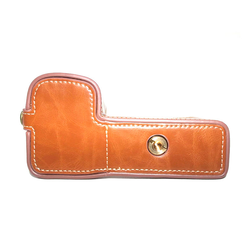 Uniqkart for Sony A6600 Anti-scratch PU Leather Camera Bottom Cover Battery Opening Design Half Body Protective Case with Hand Strap - Brown