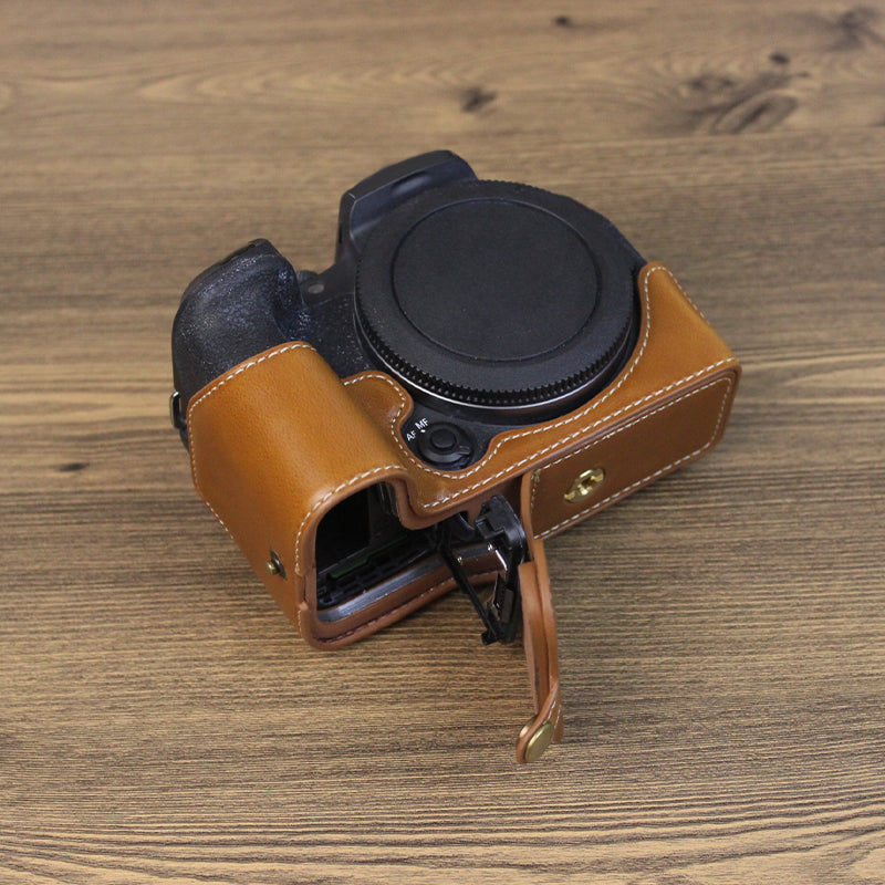 Uniqkart for Canon EOS R10 PU Leather Anti-scratch Camera Bottom Cover Large Opening Design Protective Half Body Case - Brown