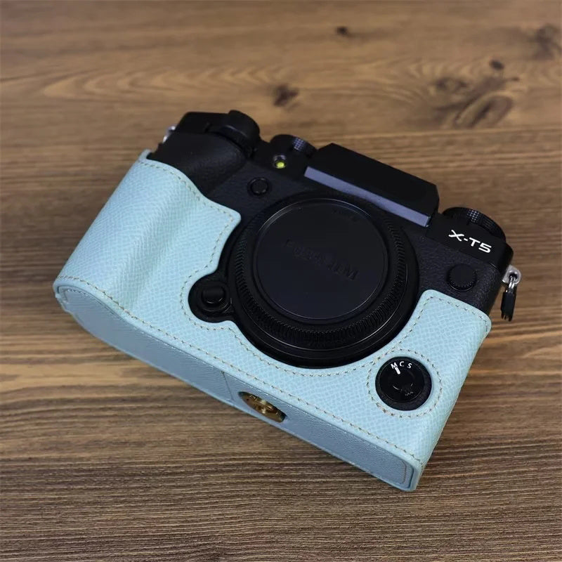 Uniqkart for Fujifilm X-T5 Camera PU Leather Protective Case Battery Opening Design Half Body Cover with Hand Strap - Baby Blue