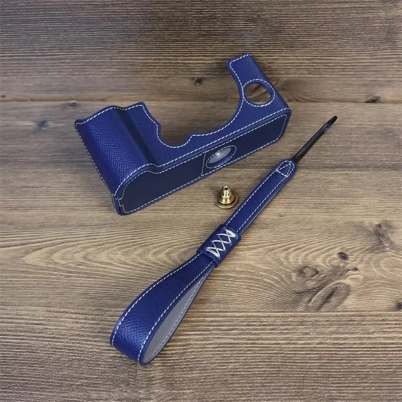 Uniqkart for Fujifilm X-T5 Camera PU Leather Protective Case Battery Opening Design Half Body Cover with Hand Strap - Blue