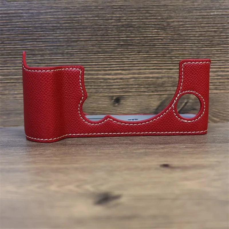 Uniqkart for Fujifilm X-T5 Camera PU Leather Protective Case Battery Opening Design Half Body Cover with Hand Strap - Red