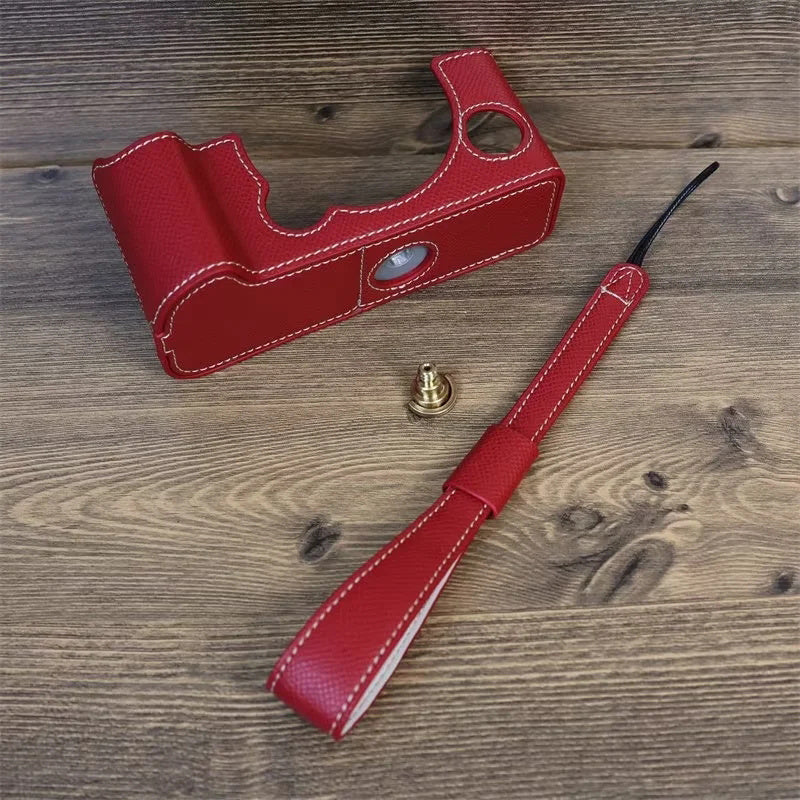 Uniqkart for Fujifilm X-T5 Camera PU Leather Protective Case Battery Opening Design Half Body Cover with Hand Strap - Red