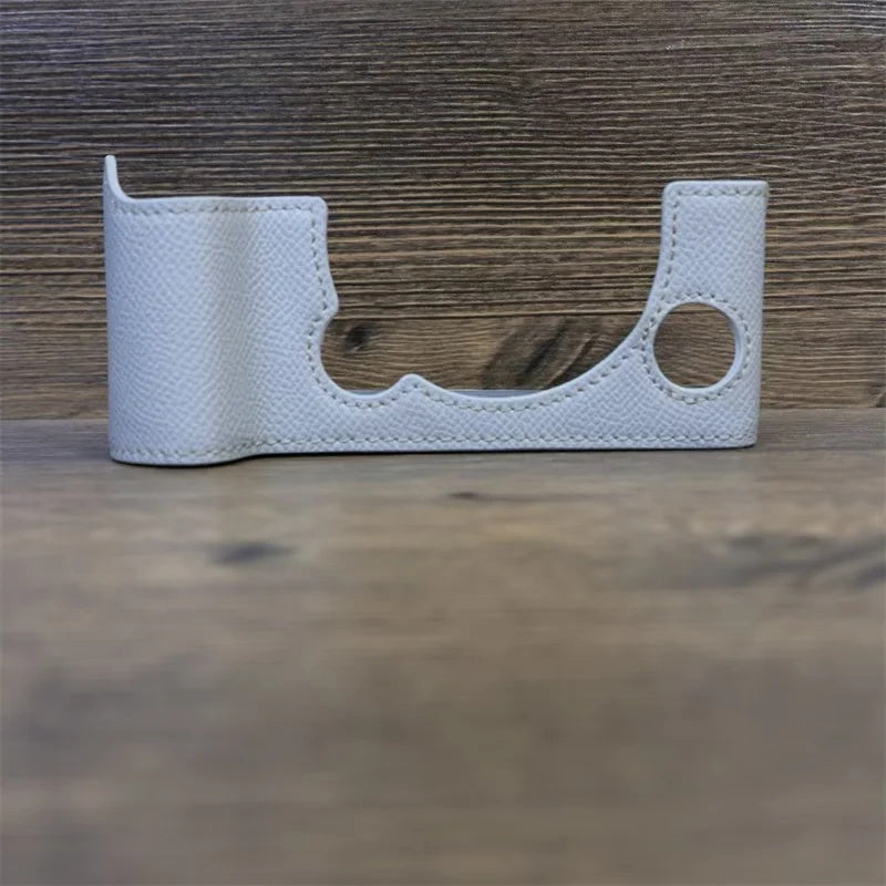 Uniqkart for Fujifilm X-T5 Camera PU Leather Protective Case Battery Opening Design Half Body Cover with Hand Strap - White