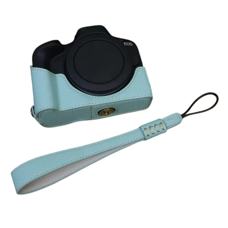 Uniqkart for Canon EOS R50 Anti-Shock PU Leather Camera Bottom Cover Large Opening Design Half Body Case with Strap - Baby Blue