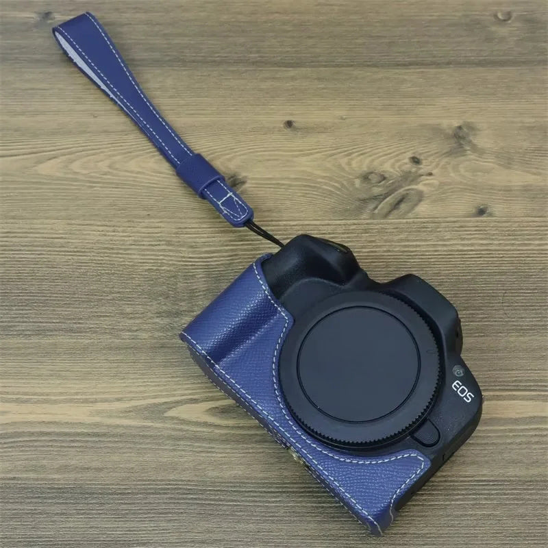 Uniqkart for Canon EOS R50 Anti-Shock PU Leather Camera Bottom Cover Large Opening Design Half Body Case with Strap - Blue