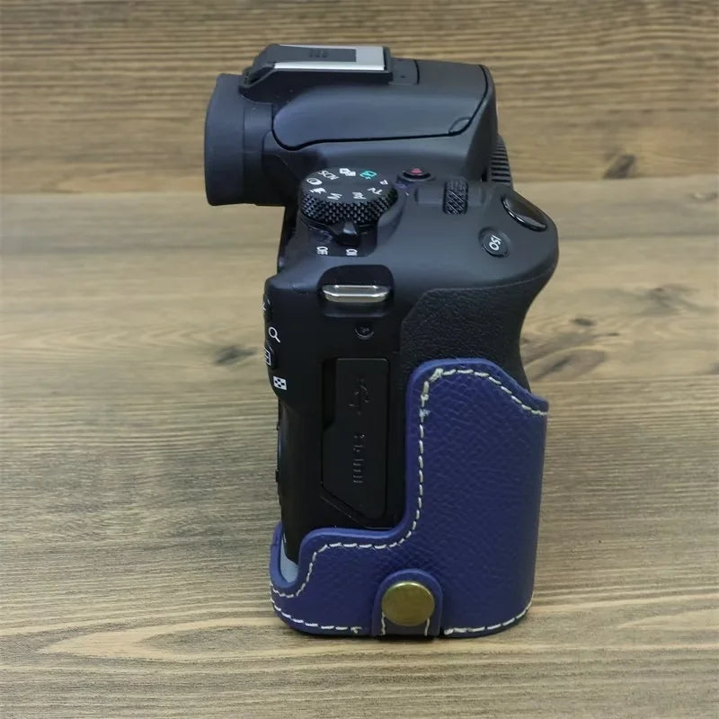 Uniqkart for Canon EOS R50 Anti-Shock PU Leather Camera Bottom Cover Large Opening Design Half Body Case with Strap - Blue
