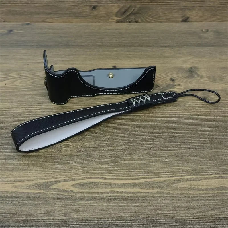 Uniqkart for Canon EOS R50 Anti-Shock PU Leather Camera Bottom Cover Large Opening Design Half Body Case with Strap - Black