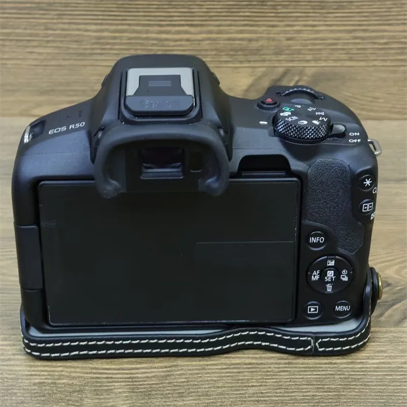 Uniqkart for Canon EOS R50 Anti-Shock PU Leather Camera Bottom Cover Large Opening Design Half Body Case with Strap - Black