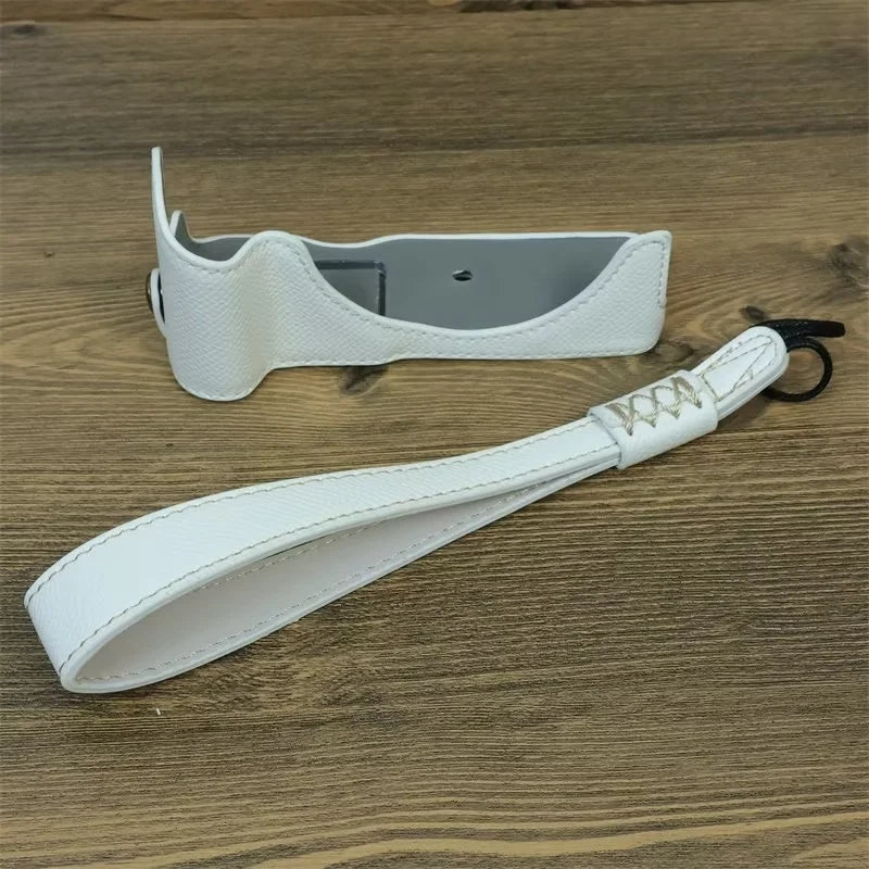 Uniqkart for Canon EOS R50 Anti-Shock PU Leather Camera Bottom Cover Large Opening Design Half Body Case with Strap - White