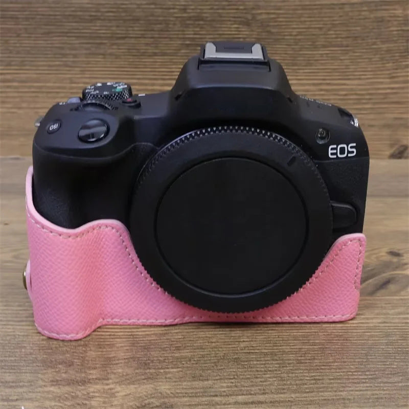 Uniqkart for Canon EOS R50 Anti-Shock PU Leather Camera Bottom Cover Large Opening Design Half Body Case with Strap - Pink