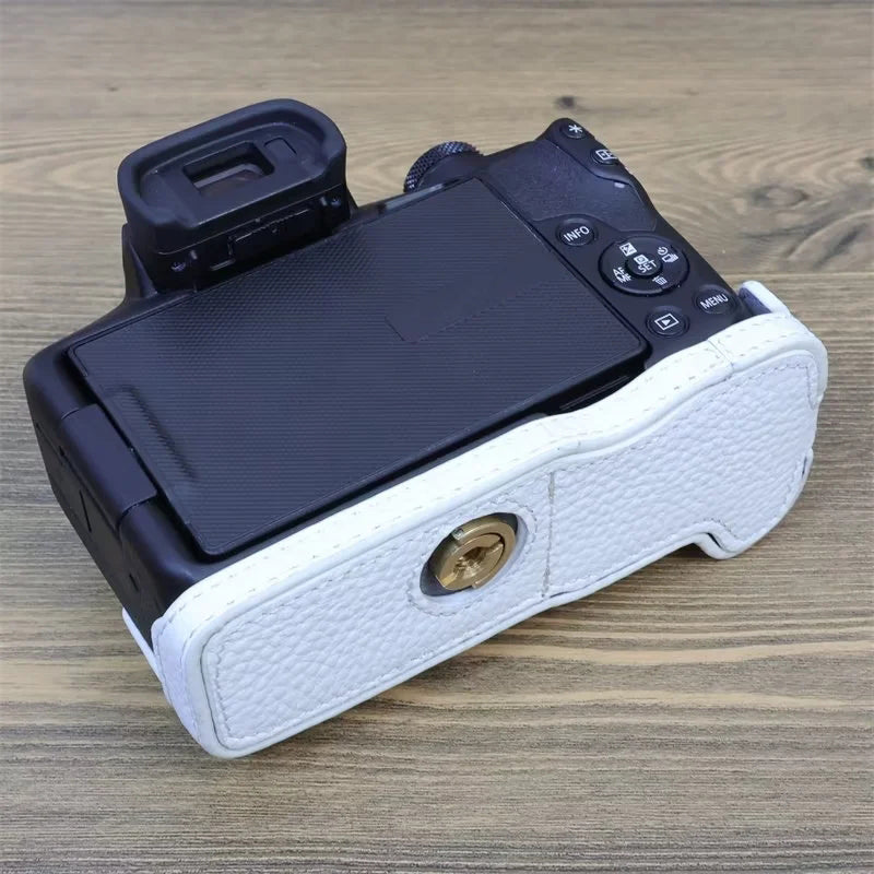 Uniqkart for Canon EOS R50 Anti-scratch Genuine Leather Camera Bottom Cover Large Opening Design Half Body Case - White