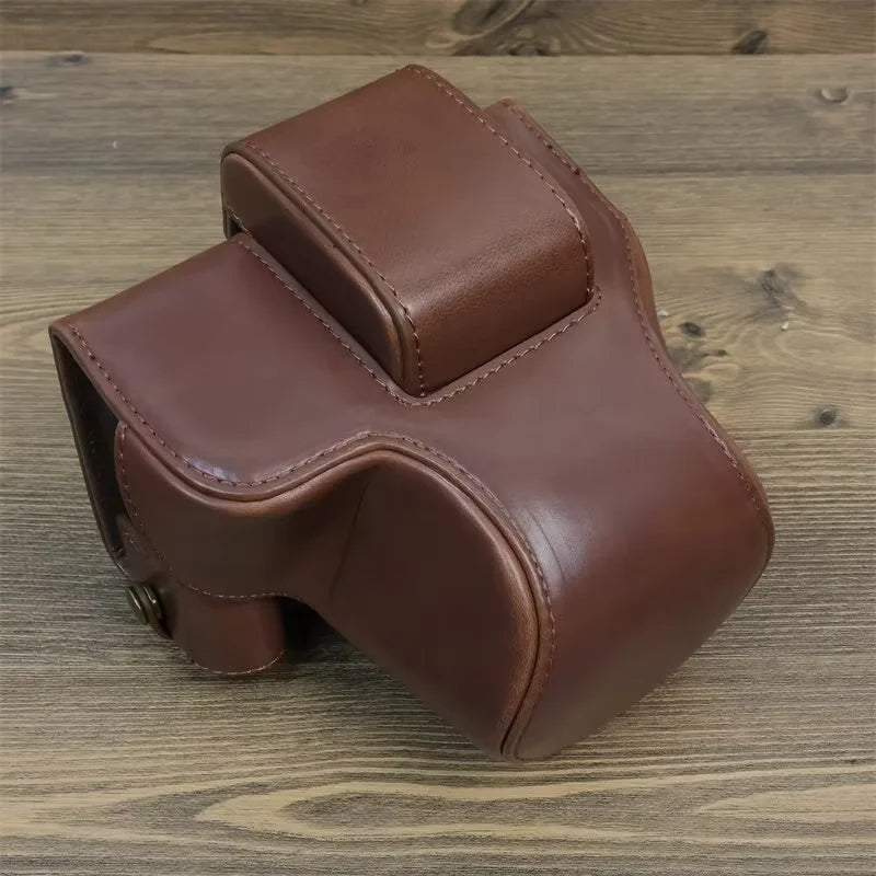 Uniqkart for Canon EOS R50 PU Leather Camera Case Battery Opening Design Camera Cover with Strap and Small Bag - Coffee