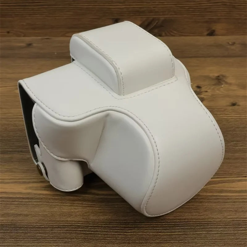 Uniqkart for Canon EOS R50 PU Leather Camera Case Battery Opening Design Camera Cover with Strap and Small Bag - White