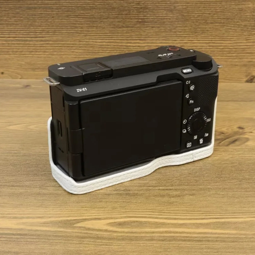 Uniqkart for Sony ZV-E1 Half Body Cover Genuine Cow Leather Camera Bottom Case with Battery Opening - White